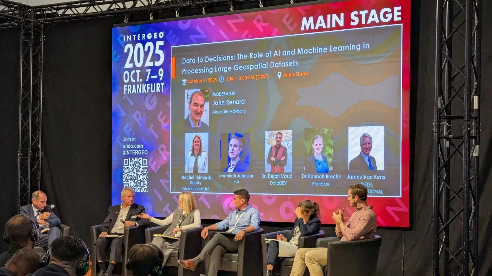 Image of CEO Rachel Tidmarsh on a panel with other members of Woolpert, on stage at Intergeo